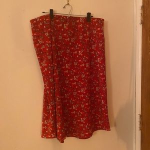 Silk like midi skirt with floral details, and elastic waist band